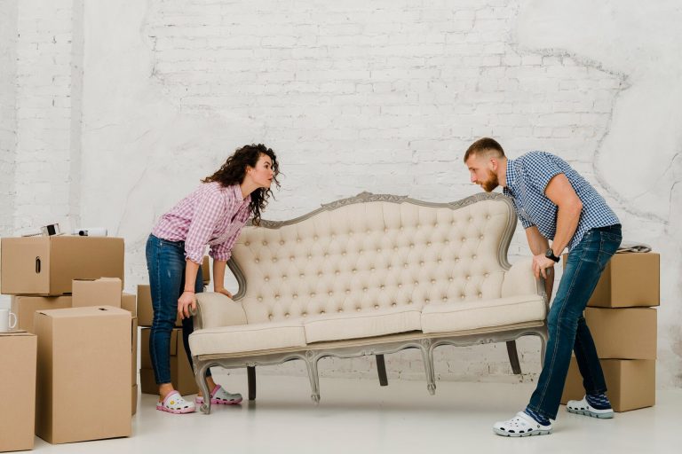 couple-moving-sofa_23-2147758716